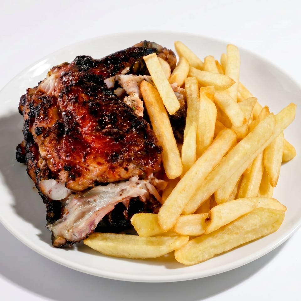 Jerk Chicken with Fries or Festival Bread.